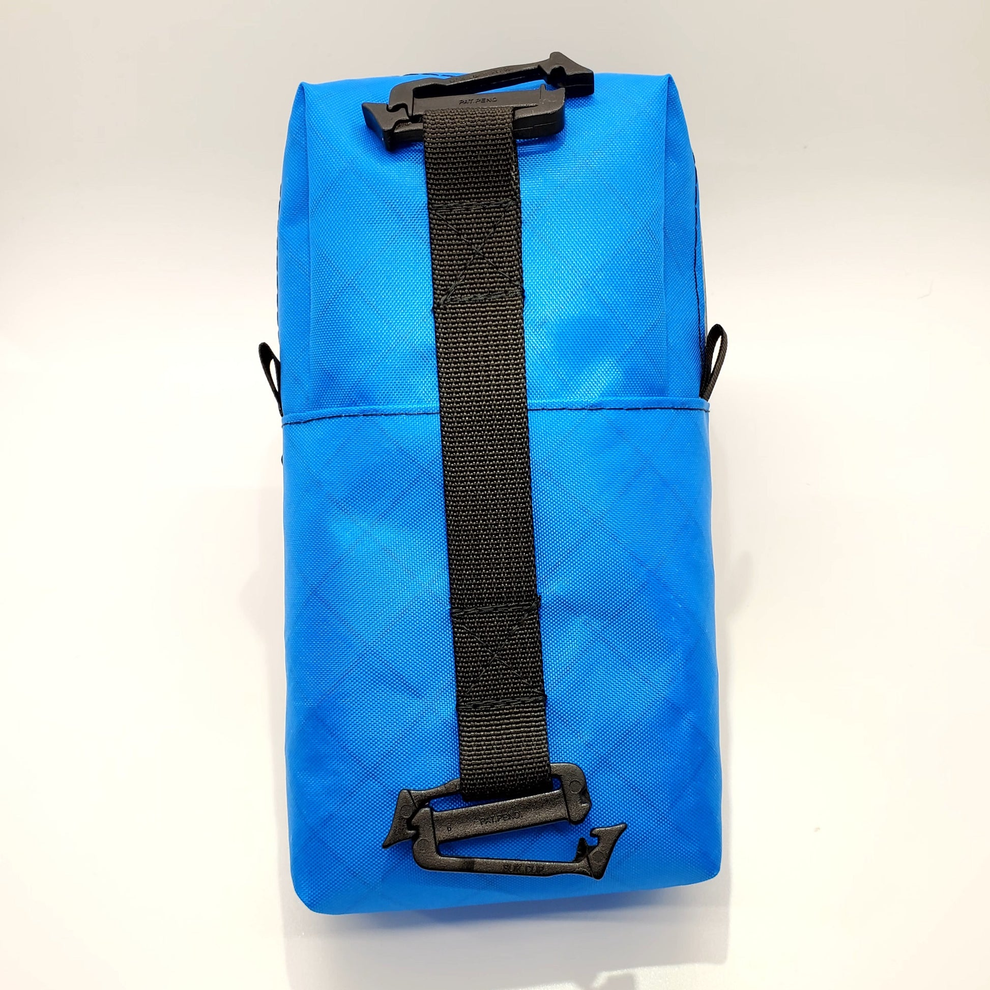 Bright blue hiking shoulder pouch back view
